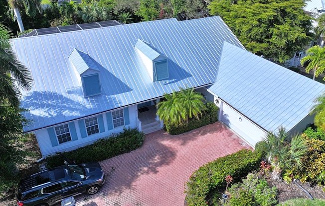 a house with a blue metal roof