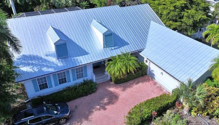 a house with a blue metal roof